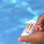 A Person Checking the pH Level of a Swimming Pool